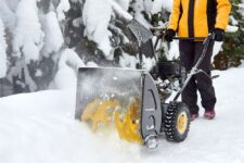 A snow thrower in action