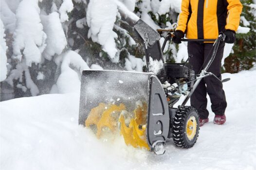A snow thrower in action