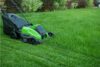 Lawn mower on a green lawn