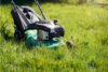 Lawn mower mowing the long grass